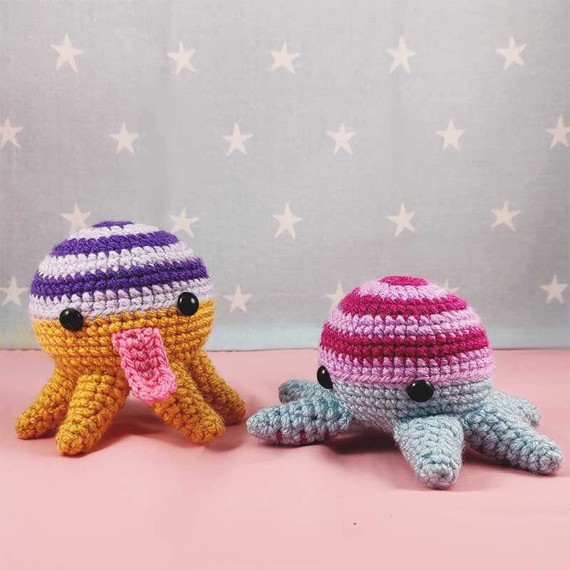 two amigurumi crochet aliens 