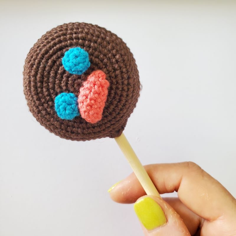 a lollipop with a sad face