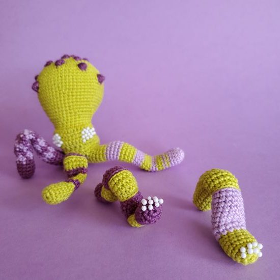 crocheted monster with tentacles
