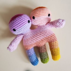 Rainbow colored crochet twins