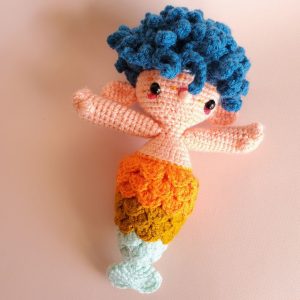Orange crocheted mermaid doll