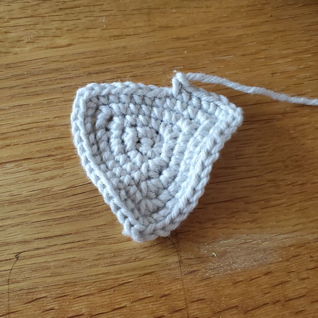 grey crochet triangle