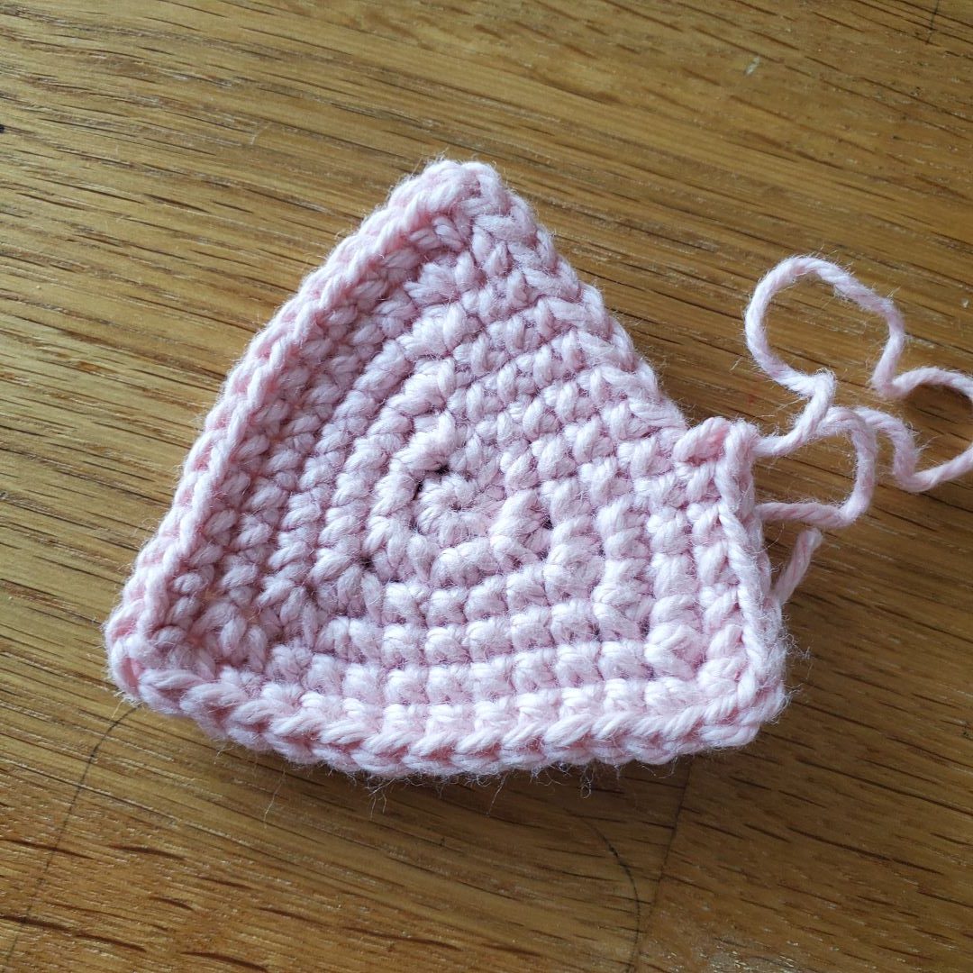 pink crochet triangle