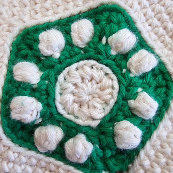 close up of the center of a crochet tree topper