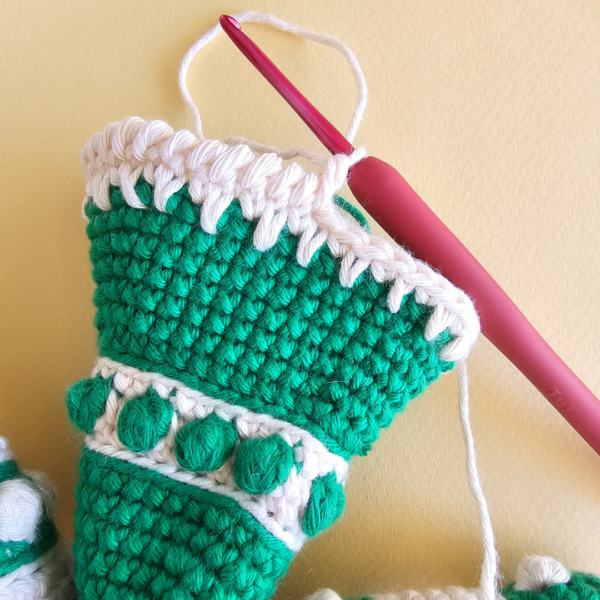 crab stitch on the edge of a crochet tree topper